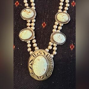 Real Turquoise and Silver necklace, Turquiose earrings, & Diamond earrings.